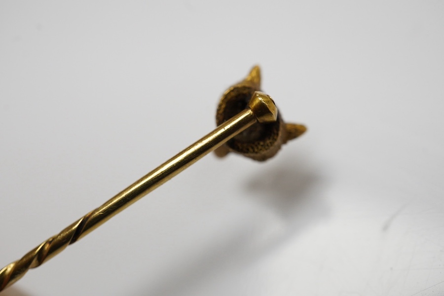 A group of gentleman's accessories, early 20th century, comprising: two pairs of cultured pearl collar studs, one set marked 15CT, each with fitted cases; a stick pin topped with the head of a fox, indistinct mark to pin